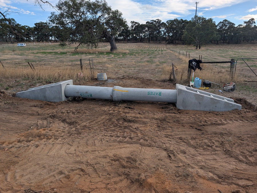 Crossover under construction, with a culvert pipe and concrete end walls placed across the drain
